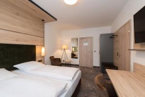 Postel nebo postele na pokoji v ubytování Hotel SCHNEIDER