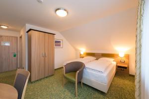 Postel nebo postele na pokoji v ubytování Hotel SCHNEIDER