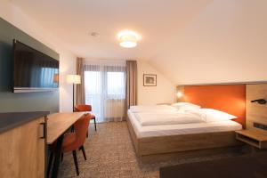 Postel nebo postele na pokoji v ubytování Hotel SCHNEIDER
