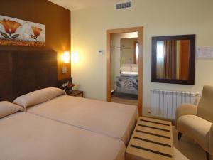 Łóżko lub łóżka w pokoju w obiekcie Hotel Macami