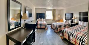 Postel nebo postele na pokoji v ubytování Tappan Zee Hotel