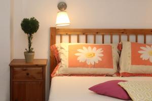 A bed or beds in a room at The Traditional House