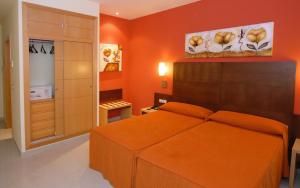 Łóżko lub łóżka w pokoju w obiekcie Hotel Macami