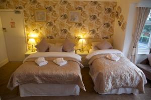 מיטה או מיטות בחדר ב-Villa Marina