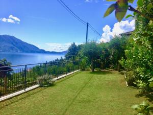 a garden with a view of a lake at Casa Briscida in Oggebbio