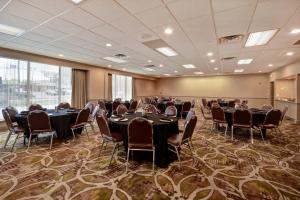 a conference room with tables and chairs in it at Holiday Inn Cincinnati-Riverfront by IHG in Covington +33 photos