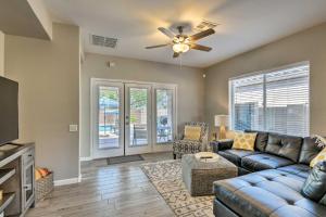 a living room with a couch and a ceiling fan at Mtn-View Home with Pool and BBQ in Gold Canyon in Gold Canyon