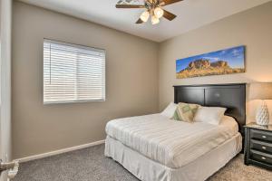 a bedroom with a bed and a ceiling fan at Mtn-View Home with Pool and BBQ in Gold Canyon in Gold Canyon +16 photos