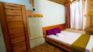 Una cama o camas en una habitación de Sagada Lodging Home