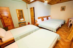 Una cama o camas en una habitación de Sagada Lodging Home
