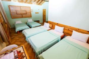 Una cama o camas en una habitación de Sagada Lodging Home