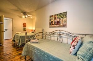 a bedroom with two beds and a painting on the wall at Serene Todd Getaway with Private Pond and Creek Views! in Todd