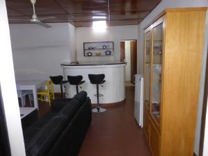 a living room with a couch and a bar at Bien être in Ouagadougou