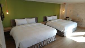 Кровать или кровати в номере Jia Inn