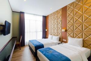 Postel nebo postele na pokoji v ubytování U3 HOTEL