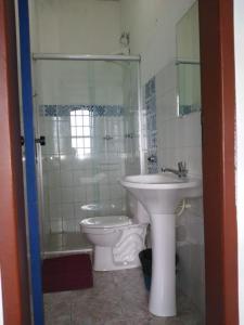 a bathroom with a sink and a toilet at Caminhos De Ouro Preto in Ouro Preto
