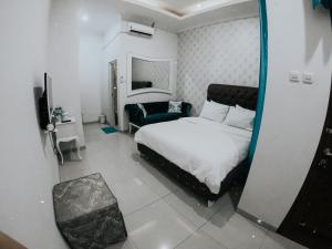 Кровать или кровати в номере Griya Suryo Wijilan