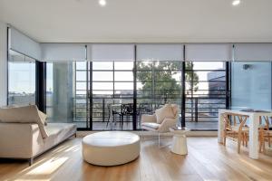 a living room with a couch and a table at 381 Cremorne in Melbourne