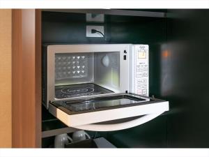 A kitchen or kitchenette at HOTEL SHINPOIN OSAKA