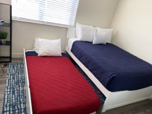 two beds sitting next to each other in a room at Moab Redcliff Condos in Moab