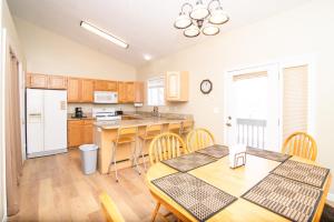 a kitchen with a table and chairs and a counter top at Heart of Ogden, 25 minutes to Snowbasin Ski Resort Duplex in Ogden
