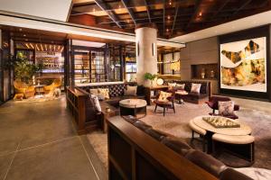 a lobby of a hotel with couches and tables at Kimpton Hotel Eventi by IHG in New York