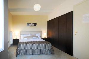 a bedroom with a large bed with two night stands at Panoramic Villa Italy in Ripe
