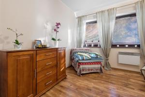 Cama o camas de una habitación en Apartamenty Nosal Residence