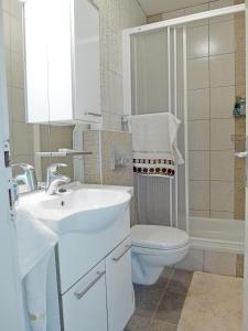 Kúpeľňa v ubytovaní Apartment Honor