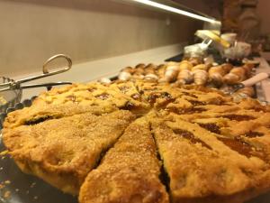 a pile of pies sitting on top of a table at Hotel Monte Rosa in Chiavari