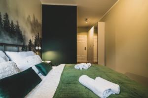 Posteľ alebo postele v izbe v ubytovaní Apartamenty Pod Gondola Świeradów + 37 fotografií