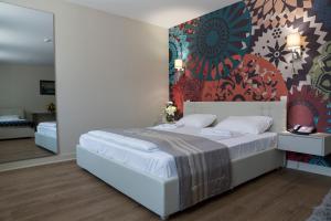 Postel nebo postele na pokoji v ubytování Zepter Hotel Drina Bajina Basta, member of Zepter Hotels