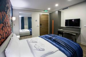 Postel nebo postele na pokoji v ubytování Zepter Hotel Drina Bajina Basta, member of Zepter Hotels