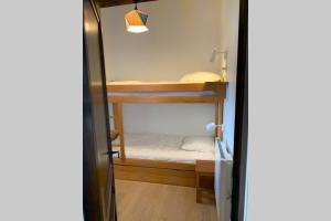 Poschodová posteľ alebo postele v izbe v ubytovaní Eden Roc Grand Massif
