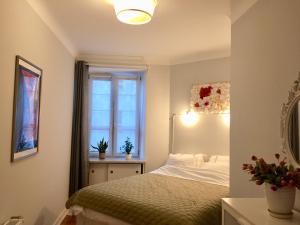 Postel nebo postele na pokoji v ubytování Beautiful apartment in the heart of Warsaw, Poznanska