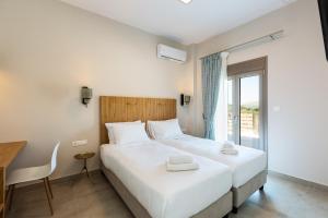 Voodi või voodid majutusasutuse Panorama Luxury Rooms toas