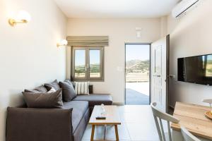 Televízia a/alebo spoločenská miestnosť v ubytovaní Panorama Luxury Rooms