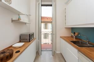 A kitchen or kitchenette at The Best Rent - Stylish loft in the center of Milan