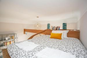 A bed or beds in a room at The Best Rent - Stylish loft in the center of Milan