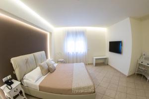 Postel nebo postele na pokoji v ubytování Hotel Victoria