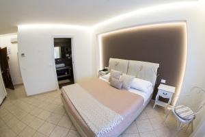Postel nebo postele na pokoji v ubytování Hotel Victoria