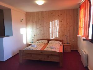 Postel nebo postele na pokoji v ubytování Studia Pod Lysou