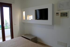 TV a/nebo společenská místnost v ubytování Hotel Victoria