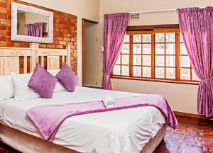 Ένα ή περισσότερα κρεβάτια σε δωμάτιο στο La Palma Hill Self Catering and B&B