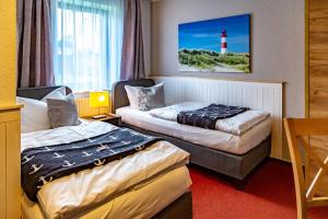 Postel nebo postele na pokoji v ubytování City-Hotel-Wolgast + 37 fotografií