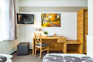 TV a/nebo společenská místnost v ubytování City-Hotel-Wolgast