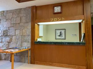 a mirror on a wall in a room at Lake View Inawashiro in Inawashiro