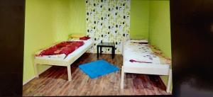 Posteľ alebo postele v izbe v ubytovaní Apartmány ELBA