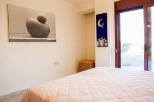 Postel nebo postele na pokoji v ubytování OLIVIERA VILLA