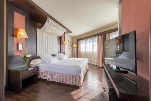 TV a/nebo společenská místnost v ubytování Hotel Cordoba Center
